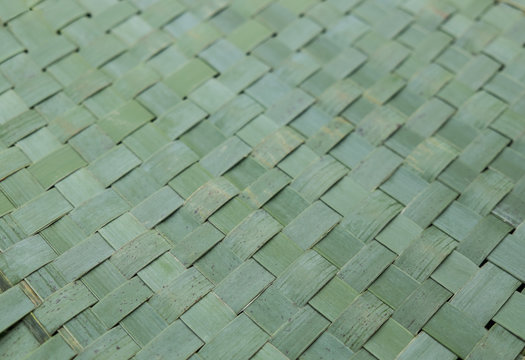 New Zealand NZ flax woven into kete or harekeke - imperfect background with blemishes; shallow depth of field