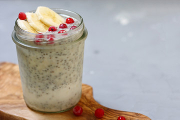 chia pudding with berry on wooden deck