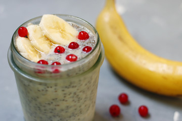 chia pudding with banana and berry with organic milk