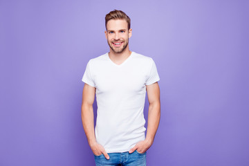 Obraz premium Handsome attractive bearded content guy in white tshirt and jean