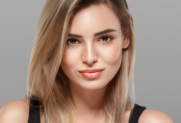 Fototapeta premium Beautiful blonde woman with curly blonde hair isolated on white with healthy skin and hairstyle female portrait natural makeup