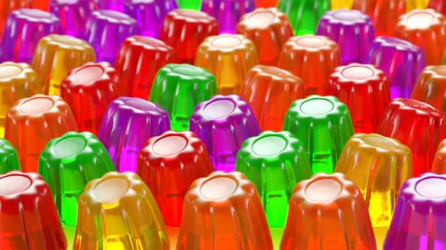 Seamless animation of multiple colorful jellies shaking. Tasty Jello desserts.
