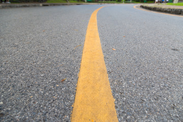 Obraz premium Close up of yellow line on the public park