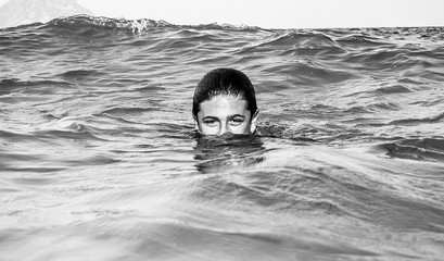 Boy with half a head in the water