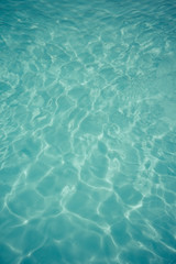 Fototapeta na wymiar light blue water texture pattern in swimming pool