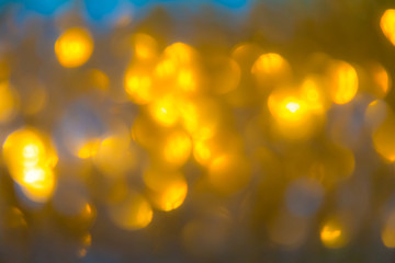 Christmas abstract background with gold bokeh defocused