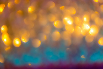 Christmas abstract background with gold bokeh defocused