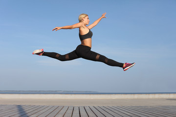 Fototapeta premium Fitness female woman jumping