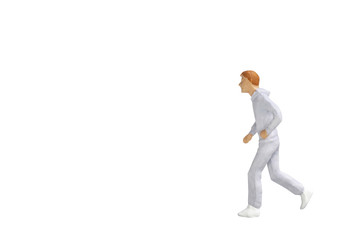 Miniature people running isolated on white background with clipping path