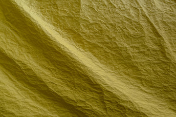 The texture of the fabric is yellow. Abstract background