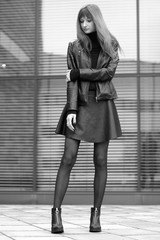 Fototapeta premium young fashionable girl in the cityscape