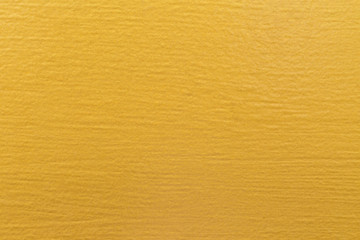 Close-up of detail Golden wall paint