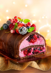 Chocolate and berries log cake.