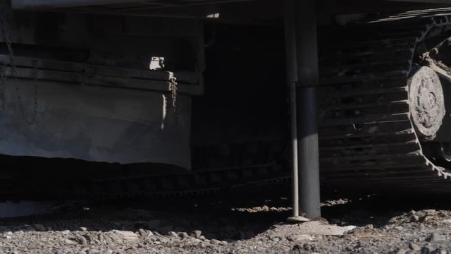 Drilling rig in the coal open pit. Drilling holes for explosives in the quarry. Slow motion, 4k, 60fps. Close up
