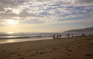 Beautiful sunset on Karon beach. The surf pounds the shore. Phuket, Thailand