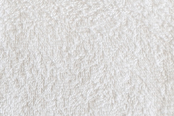 Close up view on white cotton towel. Spa and wellness thing. Selective focus