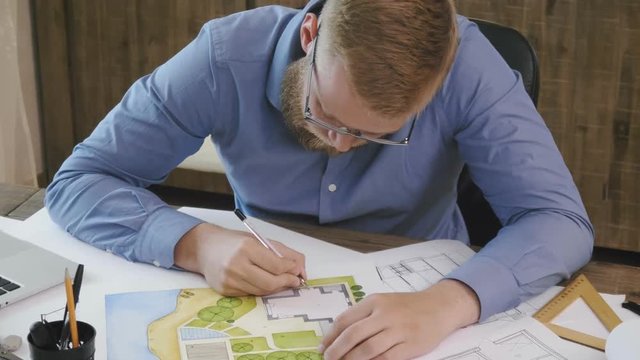 Young landscape architect designing garden plan