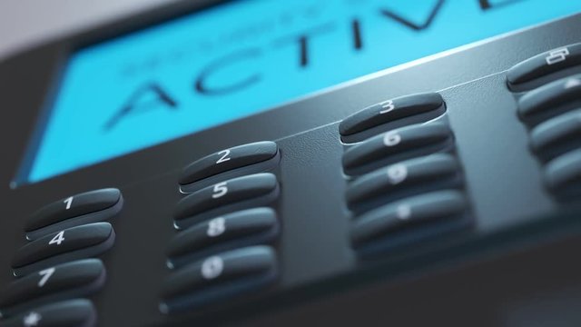 Security panel keypad on the wall. Screen showing the alarm being activated.4KHD