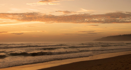 Fototapeta na wymiar Beautiful sunset on Karon beach. The surf pounds the shore. Phuket, Thailand