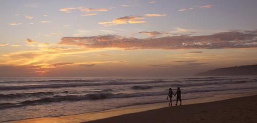 Beautiful sunset on Karon beach. The surf pounds the shore. Phuket, Thailand