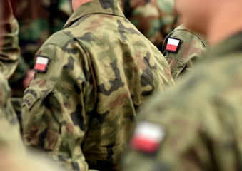 Polish patch flag on soldiers arm. Poland military uniform. Poland troops