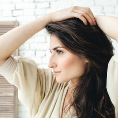 Fototapeta premium Beautiful brunette woman with long hair