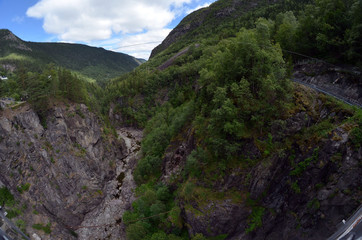 Fototapeta na wymiar The famous suspension bridge over the valley to Vemork Power Plant Rjukan Norway. Important place during WW2 and in Norwegian industrial history and Telemark sabotasje 