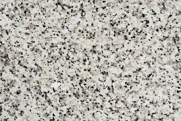 abstract texture of light marble stone with black dots