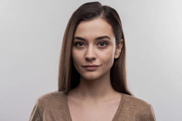 Appealing woman. Image without face retouching with appealing young dark-haired woman wearing dark...