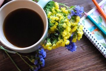 Cup of coffee and flowers