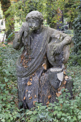 Obraz premium Historic Statue on the mystery old Prague Cemetery, Czech Republic