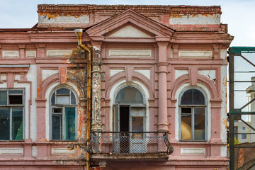 The old historic building with wood arc windows and balcony. Russia, Rostov-on-Don