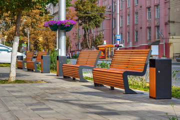 The beautiful sunny cityscape with four benches on the sidewalk. Russia, Rostov-on-Don