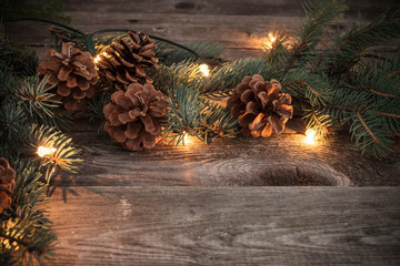 Christmas fir branches with cones and garland
