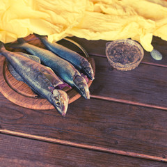 Fresh catch fish rasp three pieces on wooden table Food ingredient with copy space