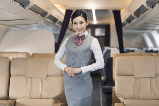 Portrait of smiling airline stewardess
