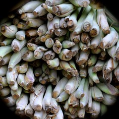 Macro view of bunches of shallots, for sale in an Asian street market