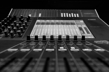 Closeup view of Faders on Professional digital Audio mixing control Console