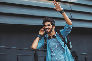 Young handsome man talking on the phone outdoor