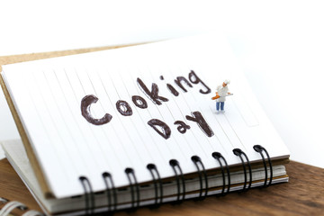 Miniature people : chef cooking using for concept of Cooking day.