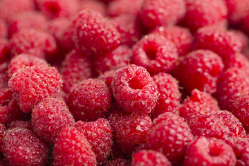 Raspberry fresh and sweet on wooden background close up