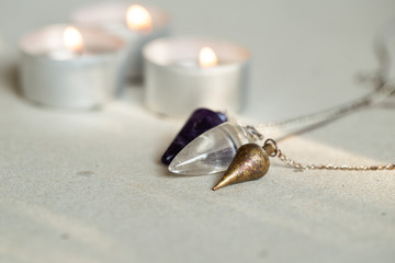 Three pendulum and candle lights