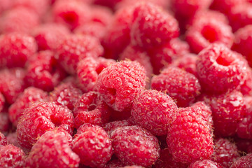 Raspberry fresh and sweet on wooden background close up