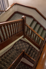 multi level stairs with old fashioned carpet