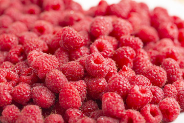 Sweet raspberry on white background close up