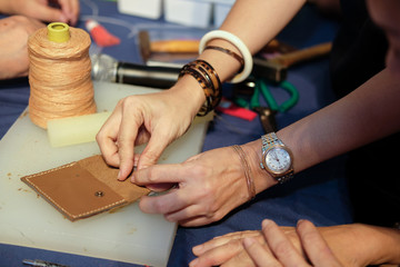 craftsman making leather bag. handmade DIY handicraft