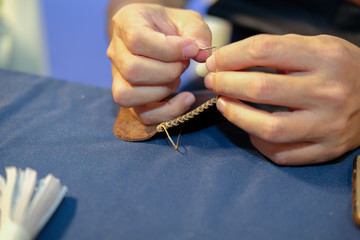 craftsman sewing making leather bag. handmade DIY handicraft