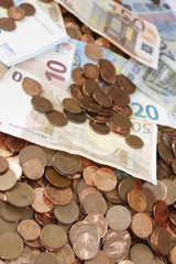 Euro bank notes with metal coins, bills background and texture