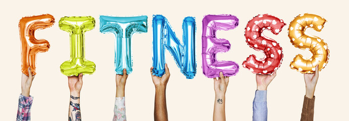 Hands showing fitness balloons word