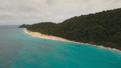 Aerial view of beautiful tropical island with white sand beach, hotels and tourists, Boracay, Puka shell beach. Tropical lagoon with turquoise water and white sand. Beautiful sea, beach, resort